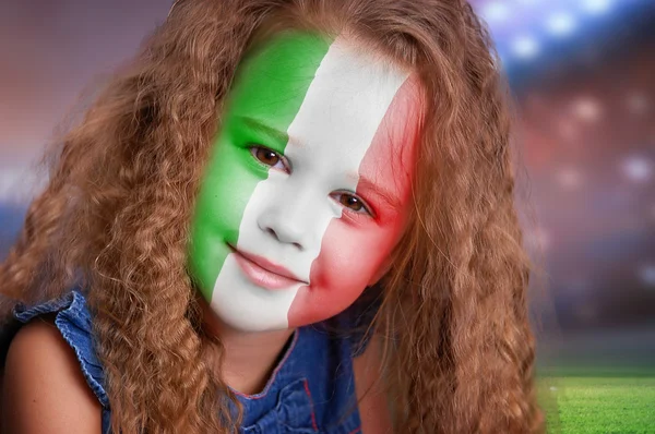 Soccer fan little girl portrait with flag of Italy on face