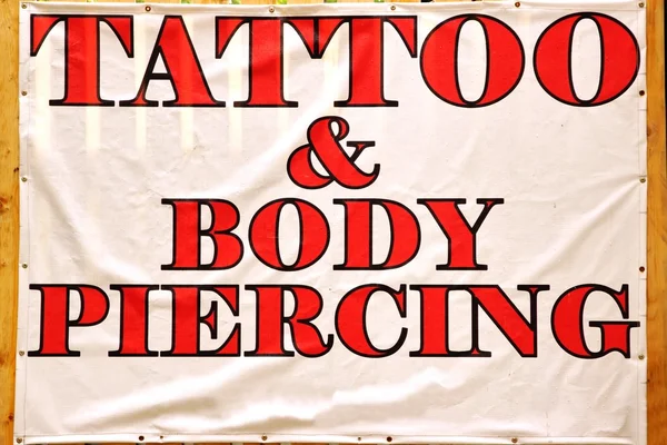 Banner with text TATTOO & BODY PIERCING