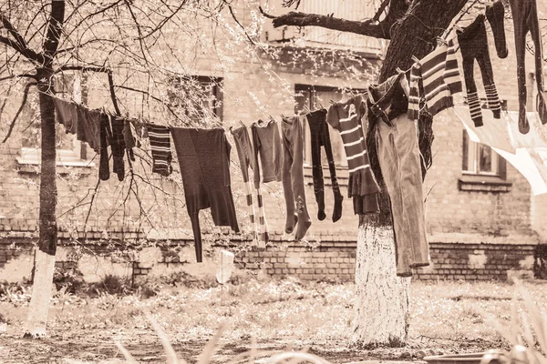 Launder clothes drying on a rope in the street