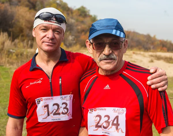 ALMATY,ALMATY DISTRICT, KAZAKHSTAN-OCTOBER 10, 2015: Men in nature are prepared to take part on the competition trail running Alatau Train Run 2016, in the national reserve Yunats Lakes among golden