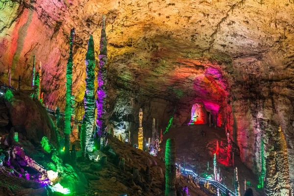 Beautiful illuminated multicolored stalactites from karst Reed Flute cave. Guilin Guangxi  China