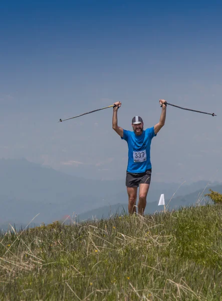 ALMATY, ALMATY DISTRIKT,KAZAKHSTAN - MAY 22, 2016: Open competition SKY RANNING 2016 held in Eliksay gorge. A man runs up to the mountain named Bukreeva participating in the competition.