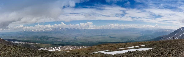 Panorama of mountains, arid wild landscape and blue sky