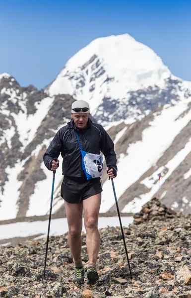 Trail runner, man and success in mountains. Running, sports