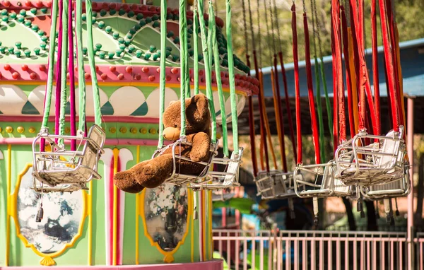 Plush animals ride on the carousel