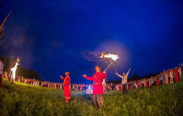 People celebrate the holiday and Russian dance in a circle around  sacred fire