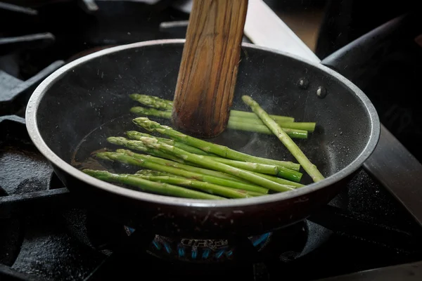 How to cook a stir fry.  motion asparagus stir fry in the pan