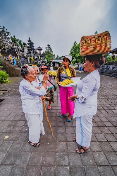BESAKIH TEMPLE, BALI, INDONESIA-AUGUST 13 : People go down after praying in Besakih temple on August 13, 2016 in Bali, Indonesia. Besakih temple is one of the most famous hindu temple in Bali island