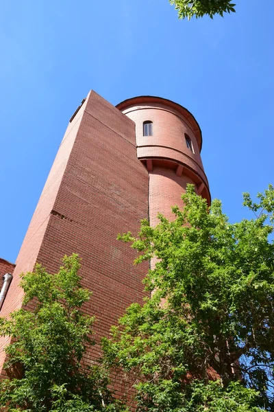A building in the form of medieval brick tower