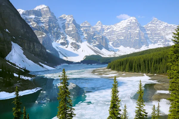 Moraine lake under the ice at spring morning.