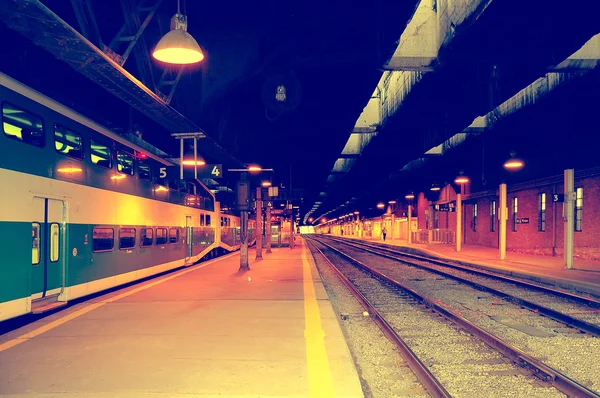 Passenger local train stands by the platform.