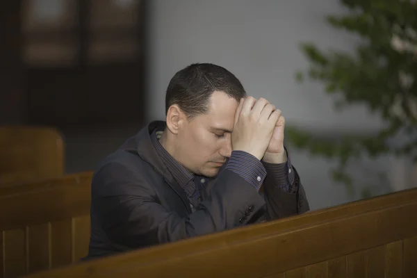 Man praying in church