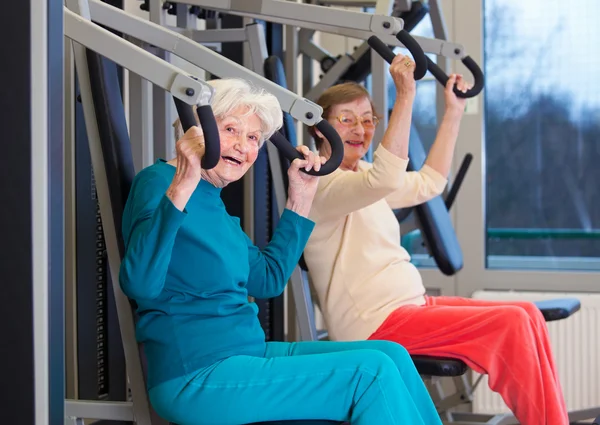 Senior women exercising in gym
