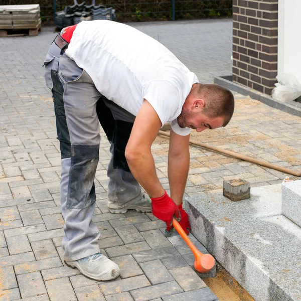 Construction worker build up pavement and terrace