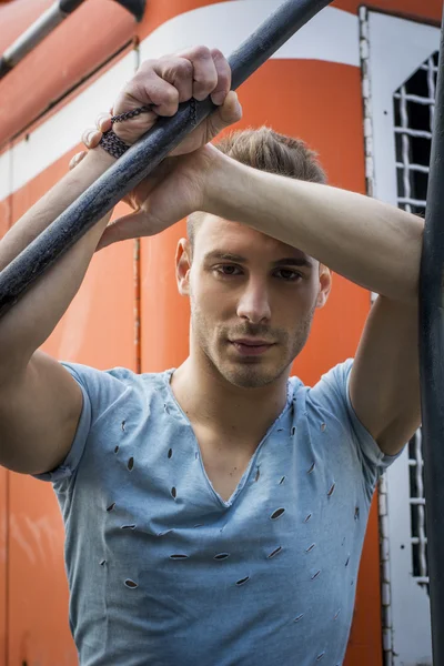 Close-up of handsome young man outside