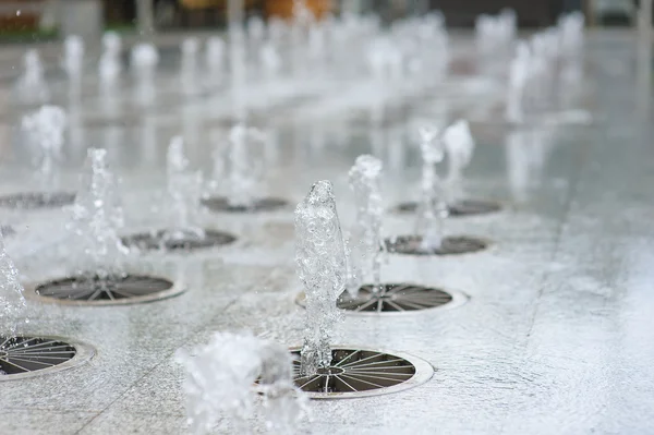 Rows of water jets in fountain