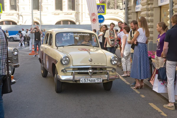 Soviet retro car Moskvich-407 on retro rally Gorkyclassic near Gum Department store, Moscow