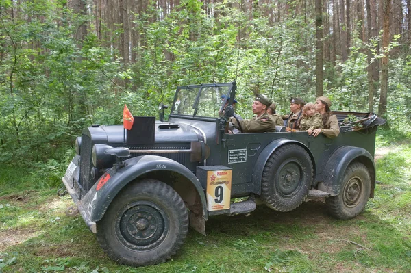 German car Horch-901 in motion on retro rally in the woods, 3rd international meeting \