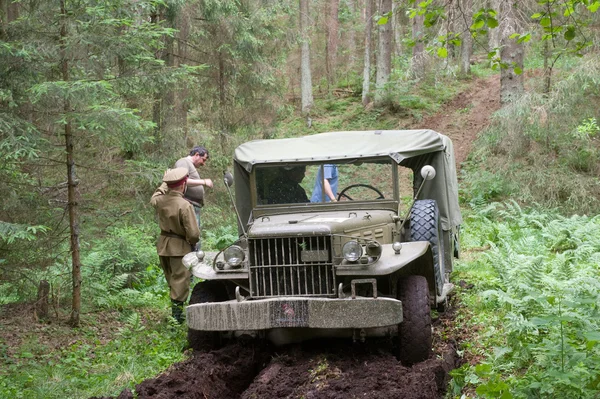 American military retro car Dodge WC-51 stuck in the woods, 3rd international meeting \