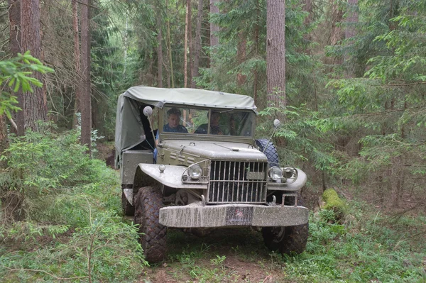 American car Dodge WC-51 in the woods on a heavy road, 3rd international meeting \