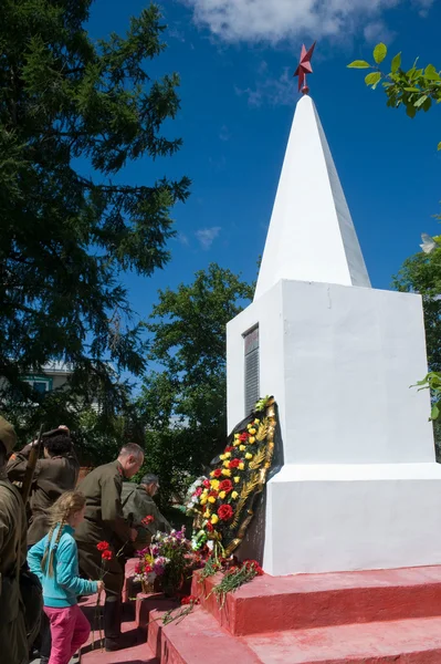 The laying of wreaths at the monument to the fallen soldiers in the village of Ivanovo near the town of Chernogolovka, Moscow region