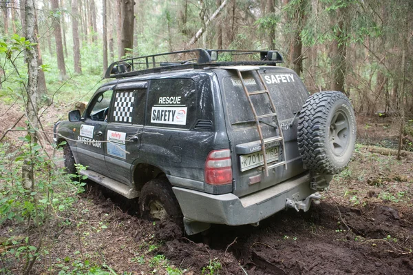 The car Toyota Land Cruiser stuck on a forest road,  3rd international meeting \
