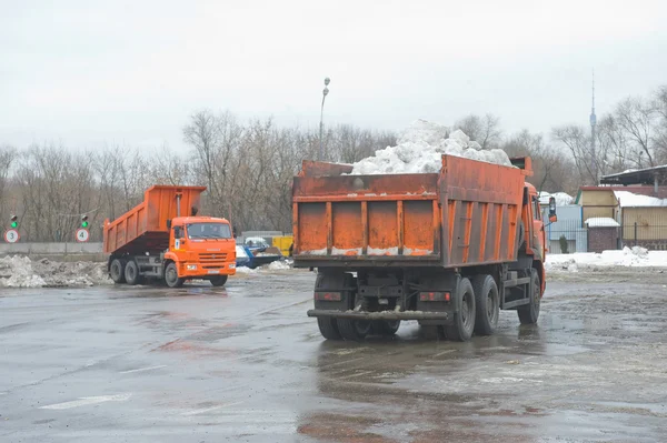 Trucks arrive at the unloading snow on snow-melting point Moscow