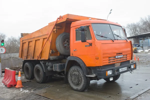 Dump truck KAMAZ - 65115 about negotable on snow-melting point, Moscow