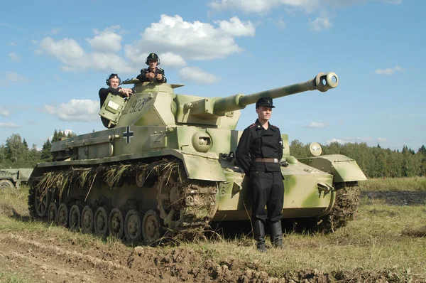 Old German Panzer IV tank with crew on the ground in the Moscow region Kubinka, MOSCOW REGION, RUSSIA