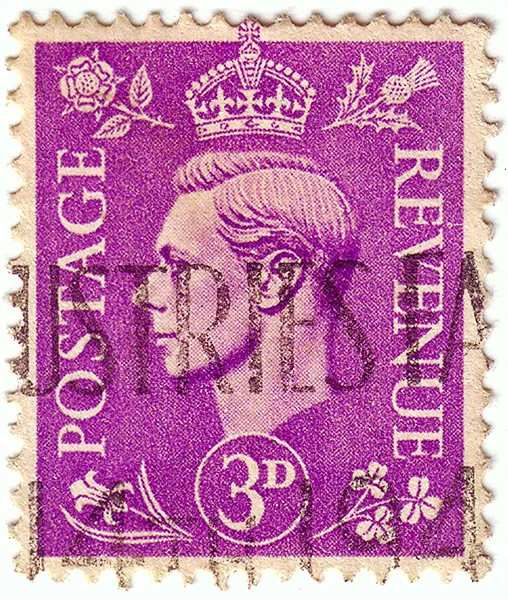 UNITED KINGDOM - CIRCA 1937 to 1947: An English three pence violet postage stamp showing Portrait of King George VI, circa 1937 - 1947