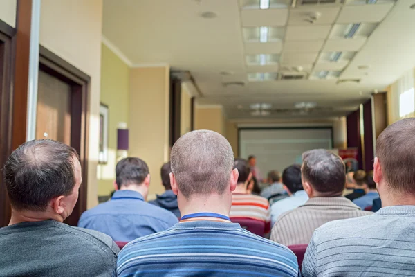 Meeting in a conference hall.