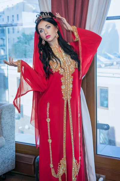 Beautiful slim woman arabian turkish oriental artist in carnival costume