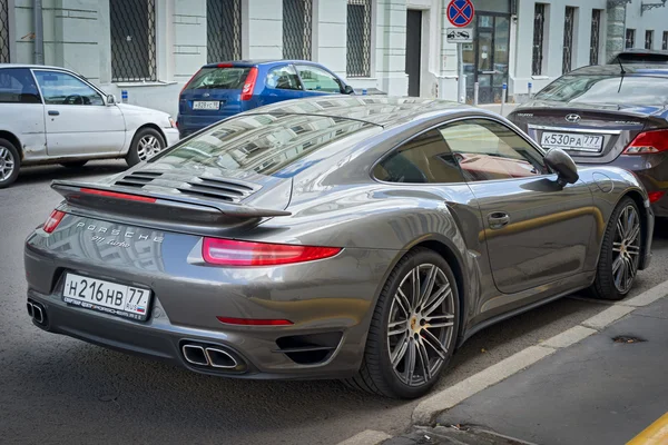 Moscow, Russia - July 10, 2016: Porsche 911 turbo parked on the street, back side view