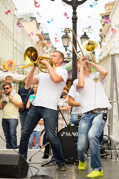 Moscow, Russia - July 10, 2016: cover band Brevis Brass Band performance on a city street. It is unique Moscow cover team with prodigious energy, consisting of a cheerful young people.