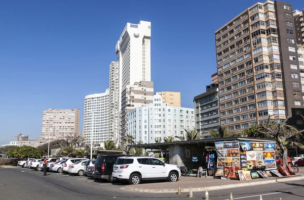 Motor Vehicles Parked Next to Street Vendor City Skyline