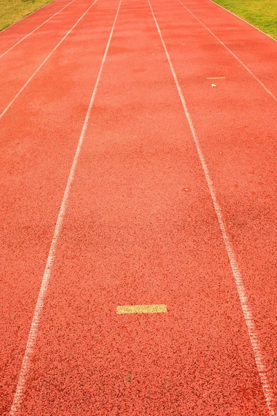 Yellow marks. White lines and texture of running racetrack, red racetrack,  in outdoor stadium