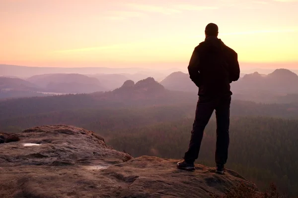 Silhouette of Young Confident and Powerful Man Standing with Hands on Hips, Late Day Sun