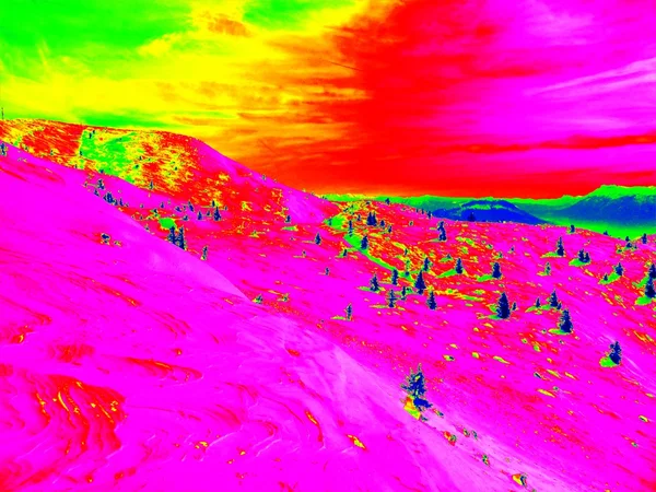 Winter ski region in Alps, free terrain at slope. Infra red photography of snowy landscape in sunny day.