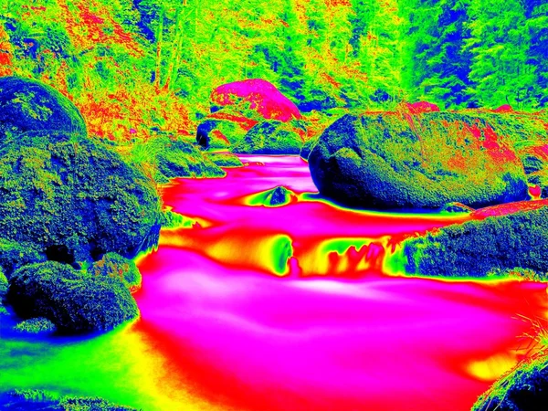 Mountain river in infrared photo. Mountain river in infrared photo. Amazing thermography. Boulders and water level in shadows of trees.