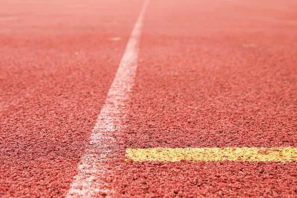 White lines and texture of running racetrack, red rubber racetracks in small stadium