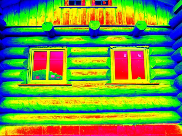 Detail of beams in cabin wall. Traditional construction of wooden house in  thermography scan.