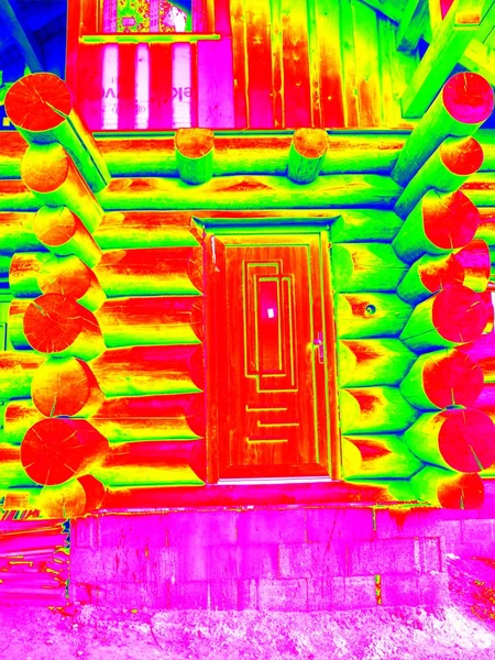 Detail of doors in beams wall in cabin. Traditional construction of wooden house in  thermography scan.