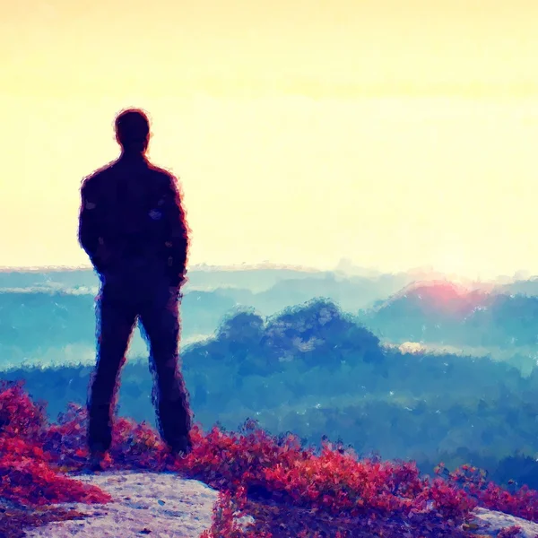 Watercolor paint. Paint effect. Awakening of Sun. Hiker in sportswear stand on the peak of sandstone rock in rock empires park and watching over the misty and foggy morning valley to Sun. Beautiful mo