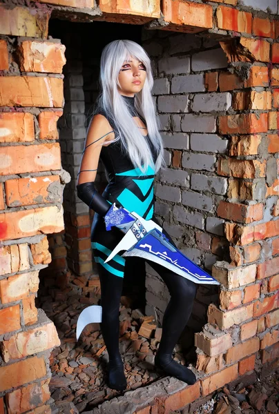 Young girl holding a blade in the dungeon