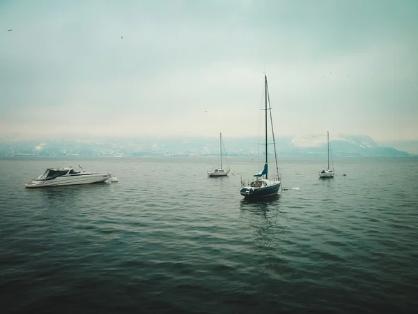 Small yachts on the lake in winter