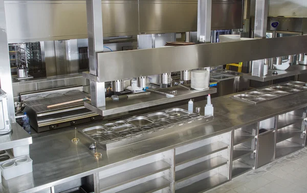 Professional kitchen , view counter in steel . Bokeh .