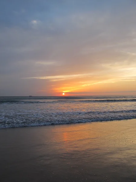Soft Sea Ocean Waves Wash Over Golden Sand Background. Sunset, Sunrise, Sun. Toned like instant photo