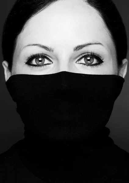 Fashion portrait of a woman with black polo neck - look at eyes