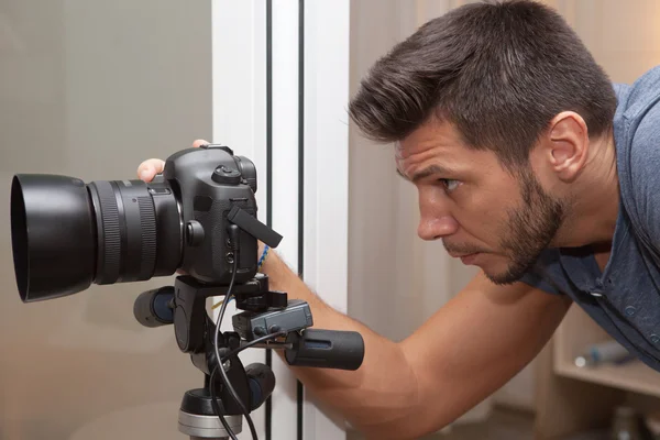 Photographer takes a video interview with a digital camera
