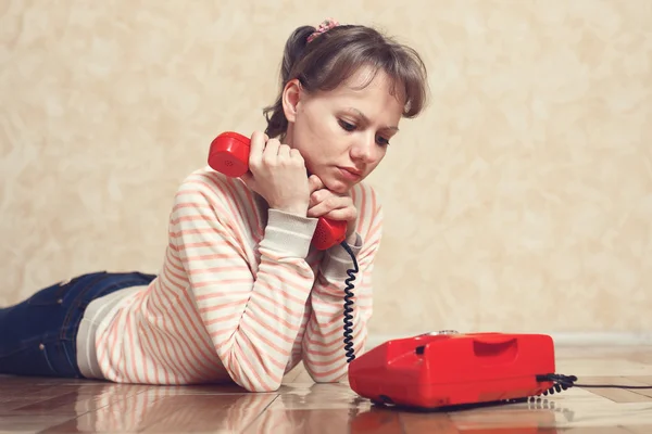 Sad girl near to phone